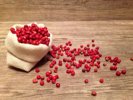 Red Pepper on wooden background 