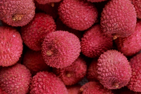 Fresh, ripe, red lychee for a backgroundの写真素材