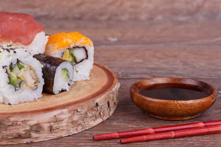 Sushi rolls set on a wooden backgroundの写真素材