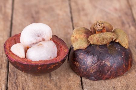 fresh, delicious mangosteen on a wooden backgroundの写真素材