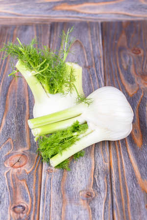 Fresh ripe fennel on a wooden backgroundの写真素材
