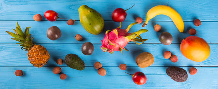 Multifruit Fresh ripe on blue wooden backgroundの写真素材