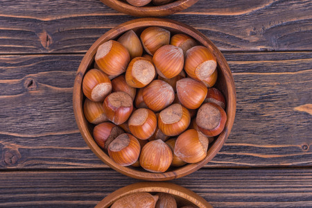 hazelnuts on wooden background