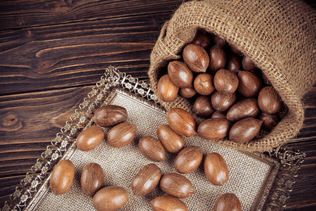 Pecan nuts on wooden backgroundの写真素材