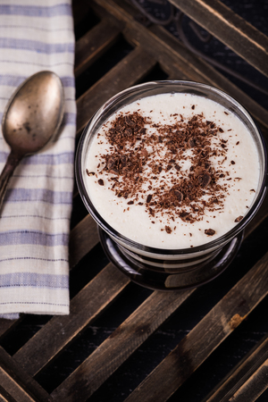 Coffee, milk choko pudding on wooden backgroundの写真素材