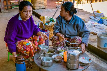 An ethnic minority woman sell vegetable in a traditional marketのeditorial素材