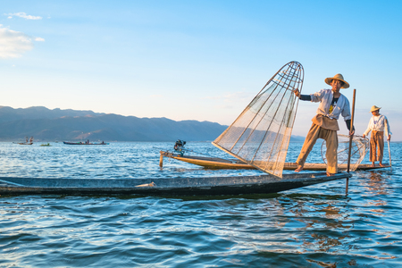 Burmese fisherman catching fish in traditional way. Inle lake, Myanmar (Burma)のeditorial素材