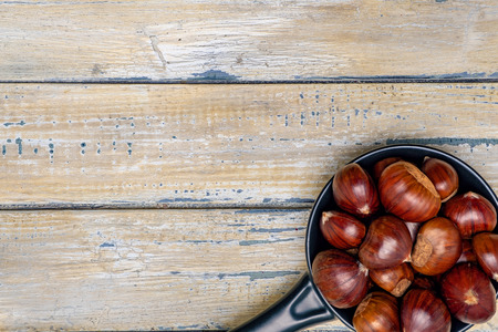 chestnuts on wooden backgroundの写真素材