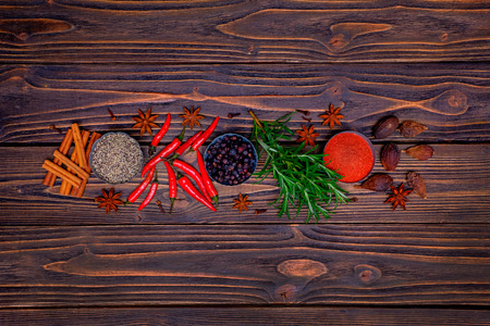 Various of spices and herbs on a wooden backgroundの写真素材