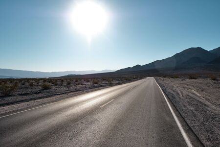 Road against the backdrop of mountains in the death valley