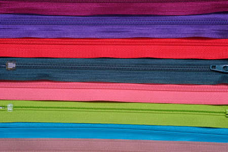 Colorful zipper for sewing and arrange as a backgroundの写真素材