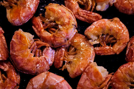 Healthy diet food: boiled wild tiger shrimps close-up on a plate on a table.の写真素材