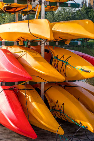 Colorful kayaks on the lake outdoor on a summer dayの写真素材