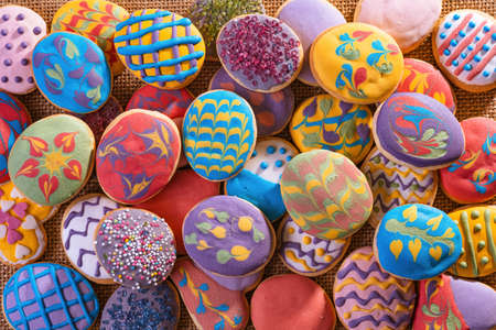 Homemade, freshly baked and decorated, colorful Easter biscuits cookies. Top view.