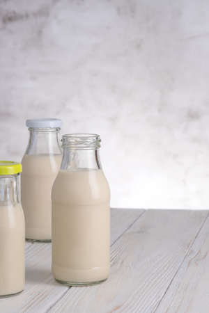 Almond milk in the bottle on white background