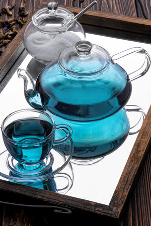 Blue butterfly pea flower tea on blue background.の写真素材