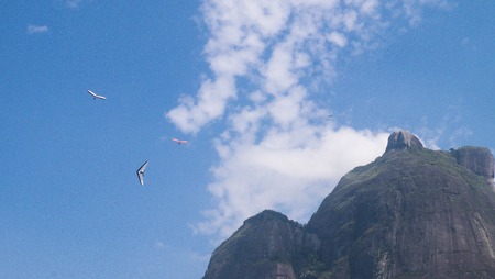Hanggliders close to Pedra da Gavea in Sao Conrado Beach. Rio de Janeiro, Brazilの写真素材