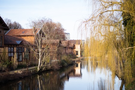 Beautiful houses overlooking the canals in a quiet part of Amsterdamの写真素材