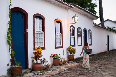 Girl walking historical streets Paraty, Rio de Janeiro, Brazilの写真素材