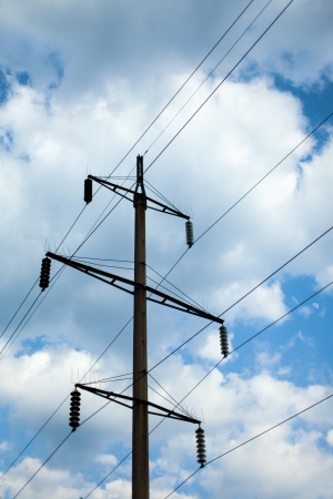 power line pole on the background of beautiful cloudsの写真素材