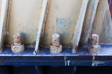 Big rusty metal nuts locked with rust and corrosion boltsの写真素材