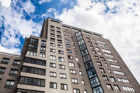 Modern, Luxury Apartment Building with clody blue sky on the backgroundの写真素材
