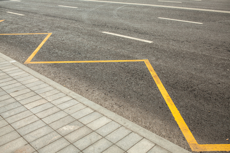 Road markings indicating no stopping or parking bus stationの写真素材
