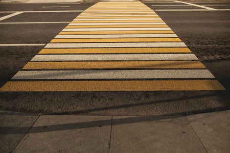new white and yellow pedestrian bacground in the city. Crosswalkの写真素材