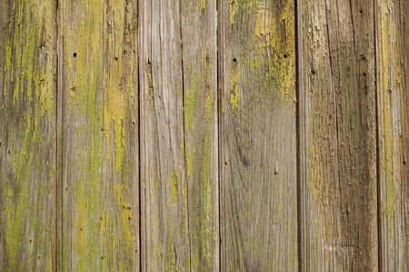 Vintage background from a wooden shabby yellow plank. Toned imageの写真素材
