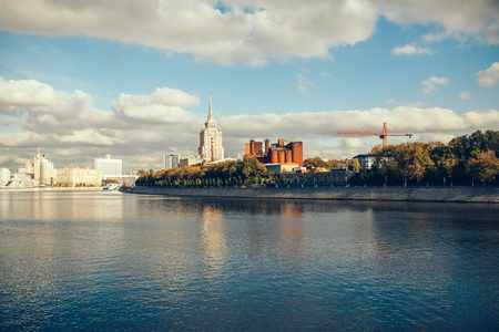 Summer view on the Moscow river with Radisson hotel on the background and cloudy skyの写真素材