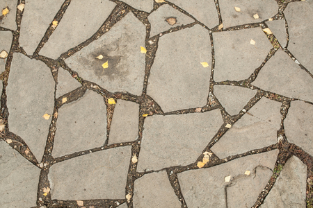 Stone floor pattern with a crack gray background close upの写真素材
