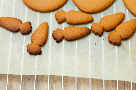 cooking and home concept - close up of female hands making cookies from fresh dough at home