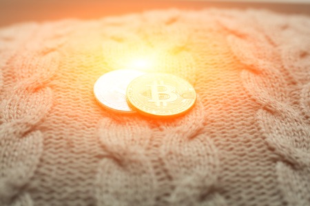 bitcoin coin on a wool background close up