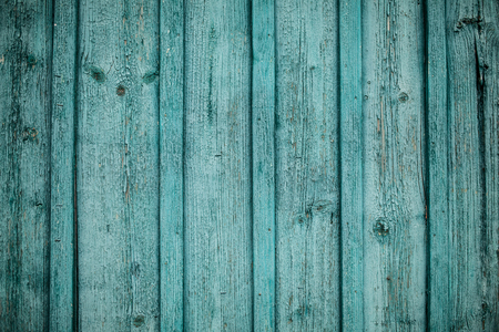 old green wooden fence background texture close upの写真素材