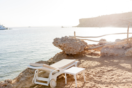 Half turn view chaise longues on the beach beach chaise longues on the summerの写真素材