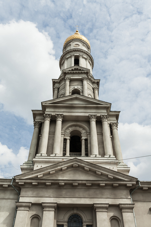 Blue sky with dramatic cloud. Yellow dome. Uspenskiy Sobor Located in the Kharkov Ukraine April 2018の写真素材