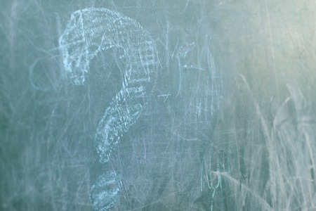 Green Chalkboard close up with wooden frame and the text question signの写真素材