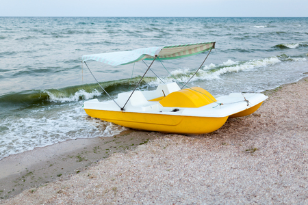 A catamaran standing on a beach with roof Evening time No people Summer leisure conceptの写真素材