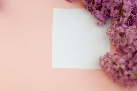 Top view flat lay empty note book with liac flowers mockup on a gray background. Text space. Vintageの写真素材
