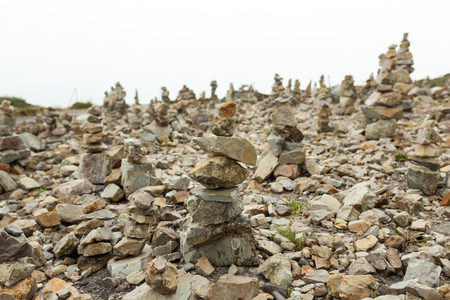 Stones stacked one on the other. Instalation near the Memorial naval aviation Cape of the Goat, France.の写真素材