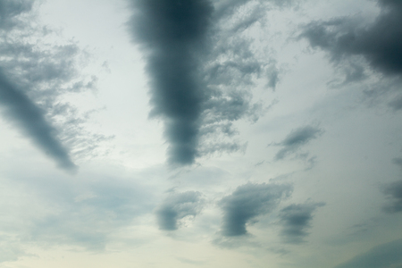 Dark ominous grey storm clouds. Dramatic sky. Nature backgroundの写真素材