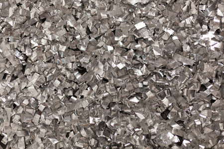 Full frame take of a sheeT of crumpled silver aluminum foil backgroundの写真素材