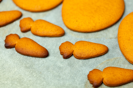 cooking and home concept - close up of female hands making cookies from fresh dough at homeの写真素材