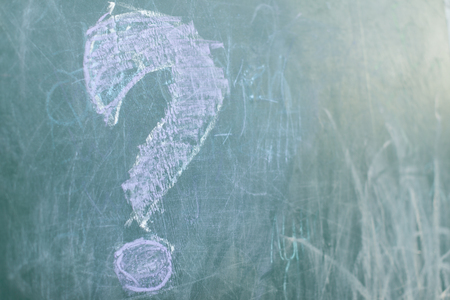 Green Chalkboard close up with wooden frame and the text question signの写真素材