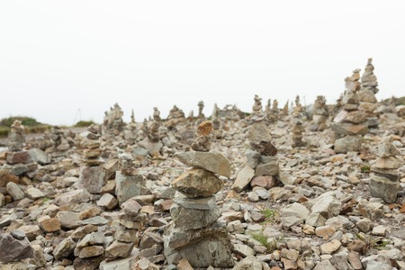 Stones stacked one on the other. Instalation near the Memorial naval aviation Cape of the Goat, France.の写真素材