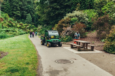 Brest, France 31 May 2018 Landscaper Worker cleaning foot way in park.のeditorial素材
