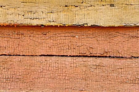 colorfull old painted horizontal wooden plank with crack and scratches background.の写真素材