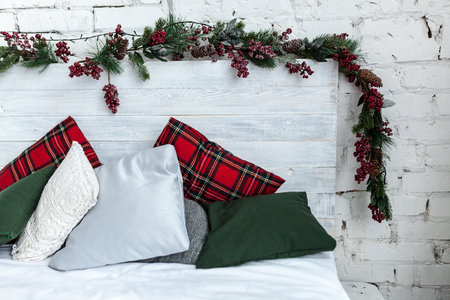 New year bedroom interior. Bed with cozy cushionsの写真素材
