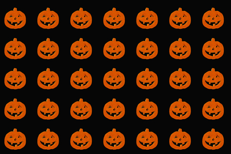 Orange halloween pumpkins on the blackbackground Isolated. paper for wrappingの写真素材