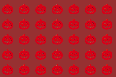 Red halloween pumpkins on the brown background Isolated. paper for wrappingの写真素材